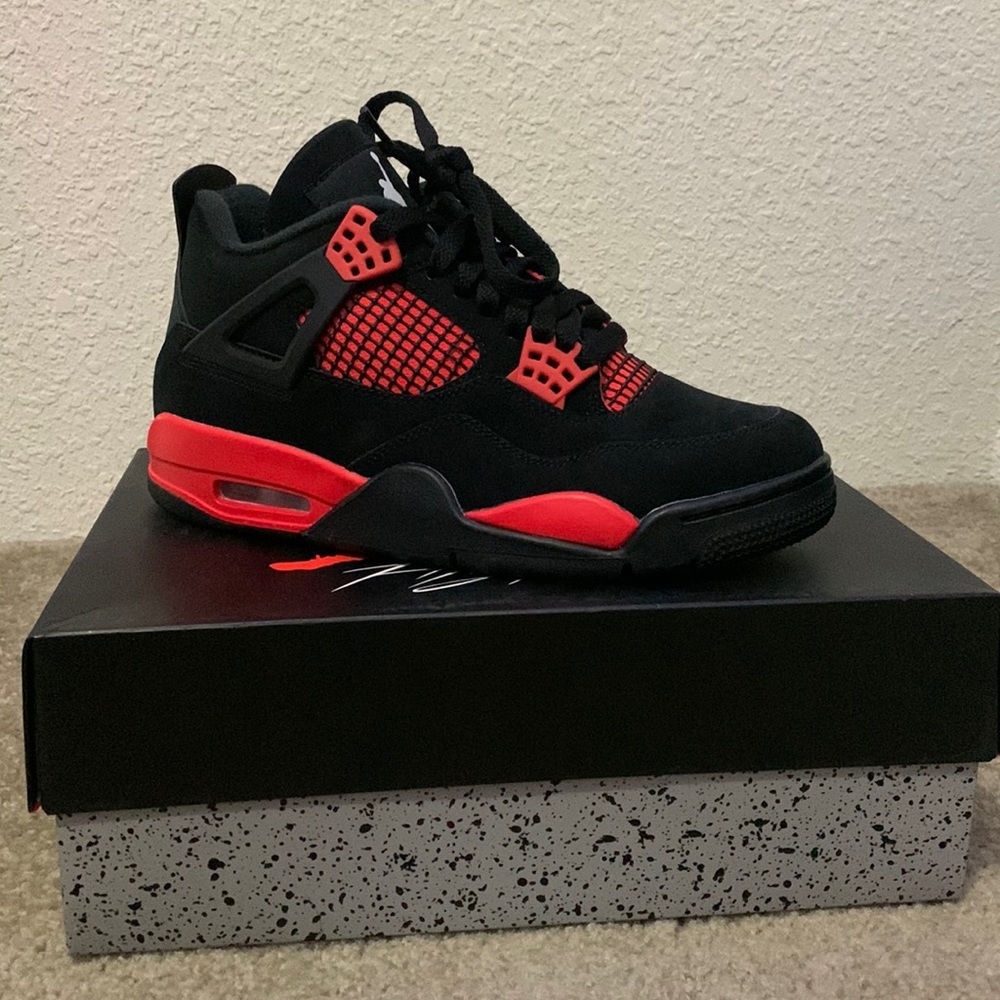 Red Thunder Air Jordan 4 retros, perfectly in shape, never worn.